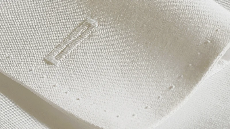 Handmade buttonhole with hand topstitch detail